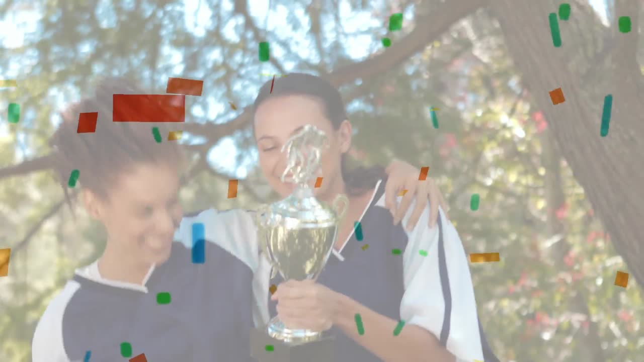 컵 치어링 을 하는 여자 축구 선수 들