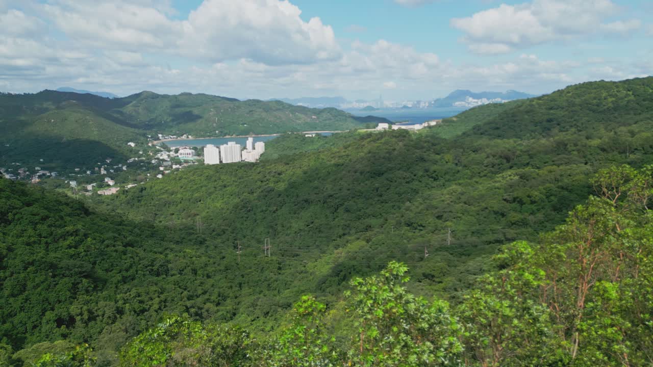 Footage of Mui Wo, a rural town on Lantau Island in Hong Kong, featuring coastal scenery, traditional buildings, lush greenery, and the serene lifestyle of this eastern coastal town