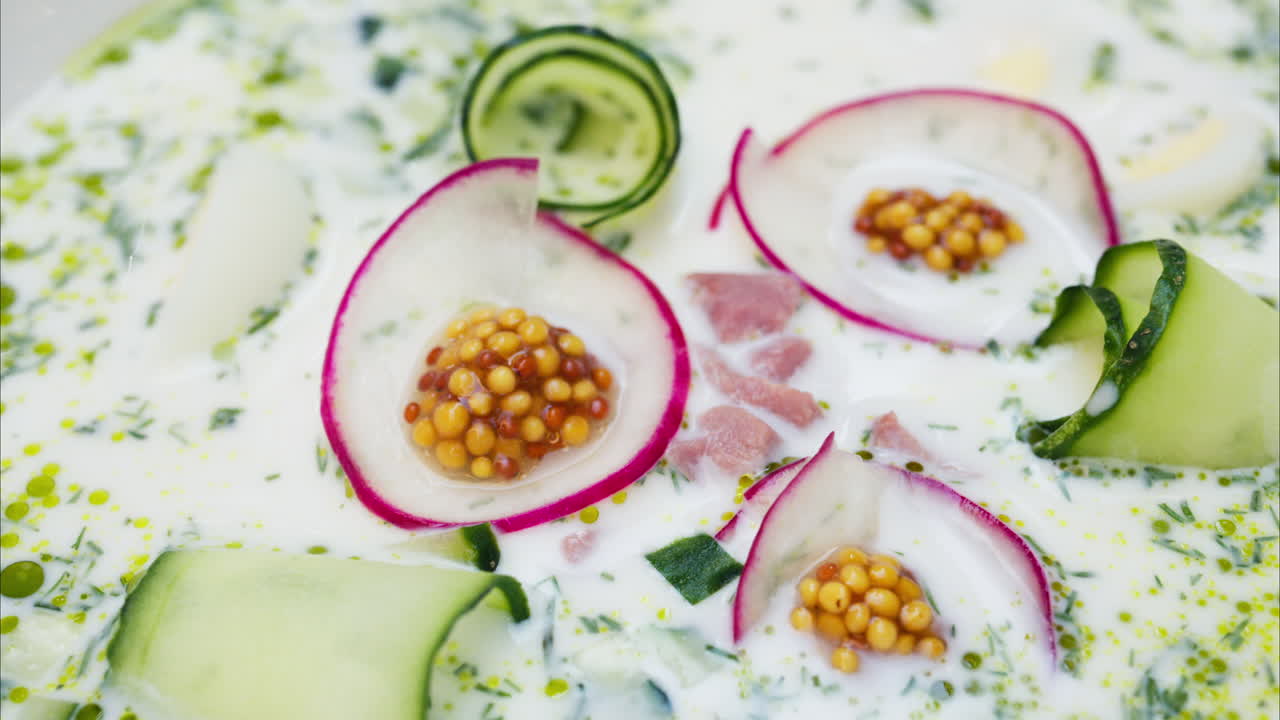 Close up of an Okroshka soup in a white plate