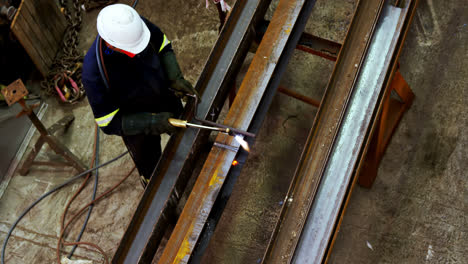 male engineer using welding torch 4k