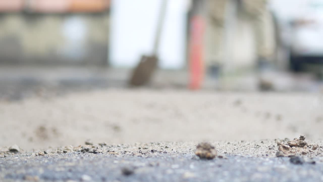 Worker repairing a road