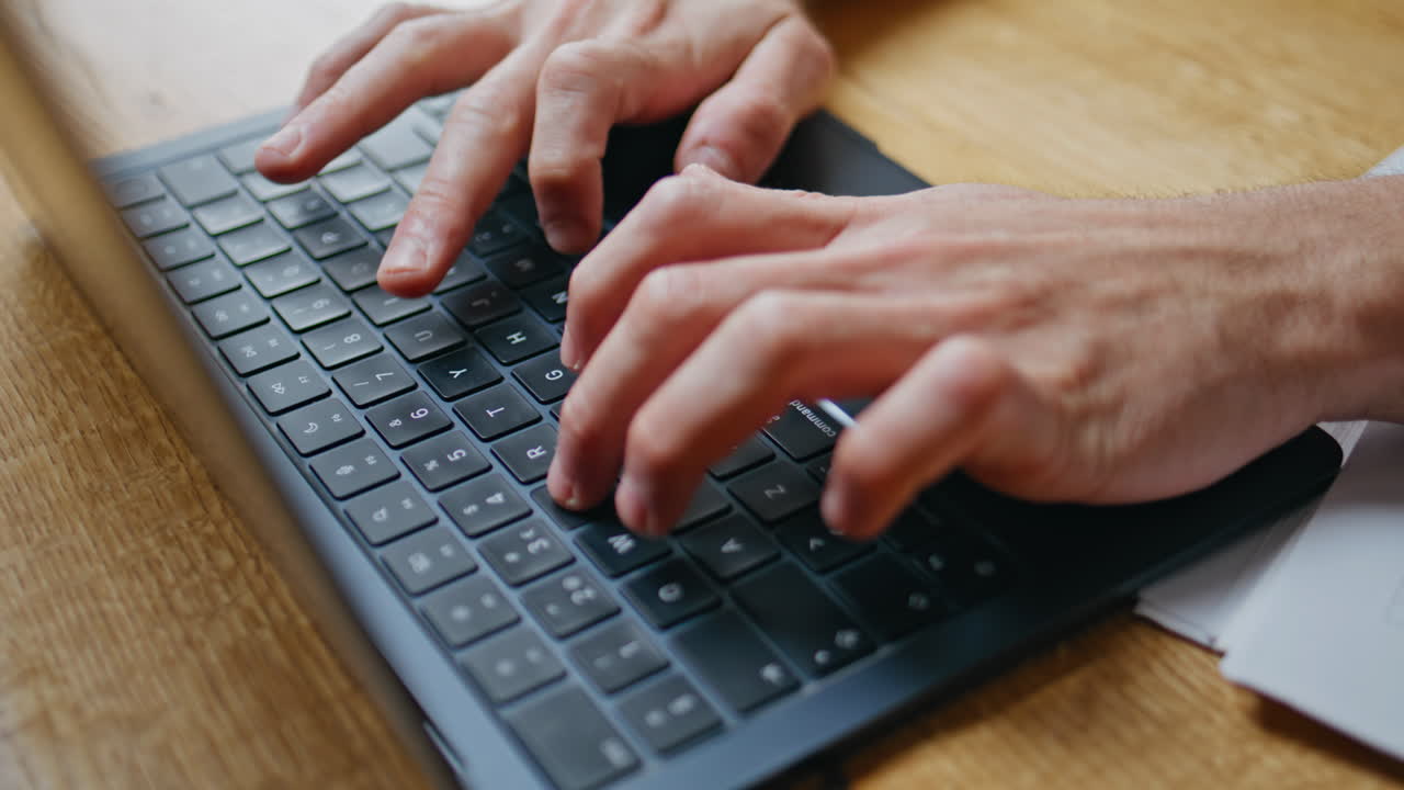 Man hands typing laptop on office wooden table closeup. Male manager working