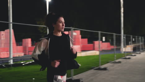 Sportive-Sportswoman-Running-In-The-Park-At-Night-1