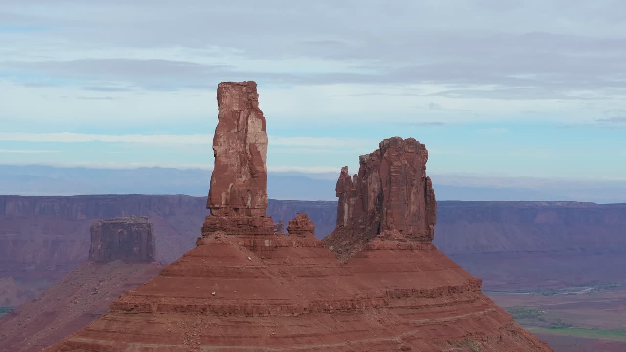 Moab's Castleton Tower stands majestically against a serene desert backdrop