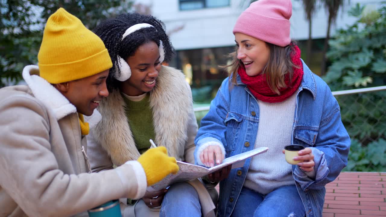 Friends looking at a map outdoors