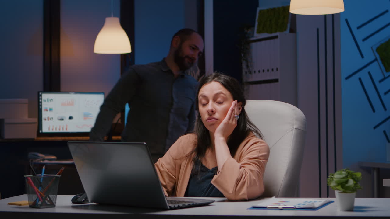 Exhausted workaholic executive manager woman typing financial strategy