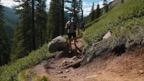a person hiking or running on a mountain trail