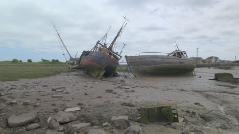 old shipwrecks and shopping cart abandoned dockland, slow motion at fleetwood docks, lancashire, uk, sony fx30