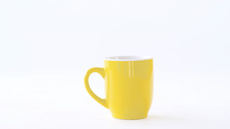 black coffee served in yellow cup