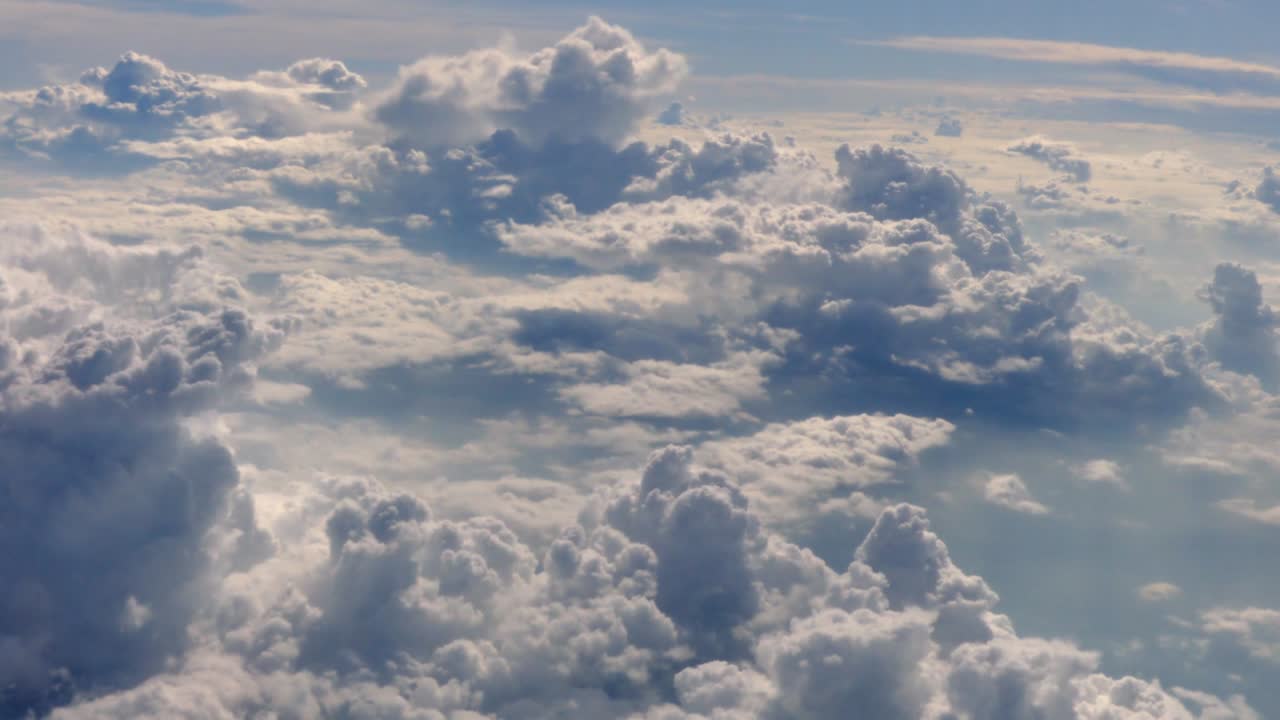 Clouds sky viewed from the windows of an airplane. Flying above the clouds, flying in the air.