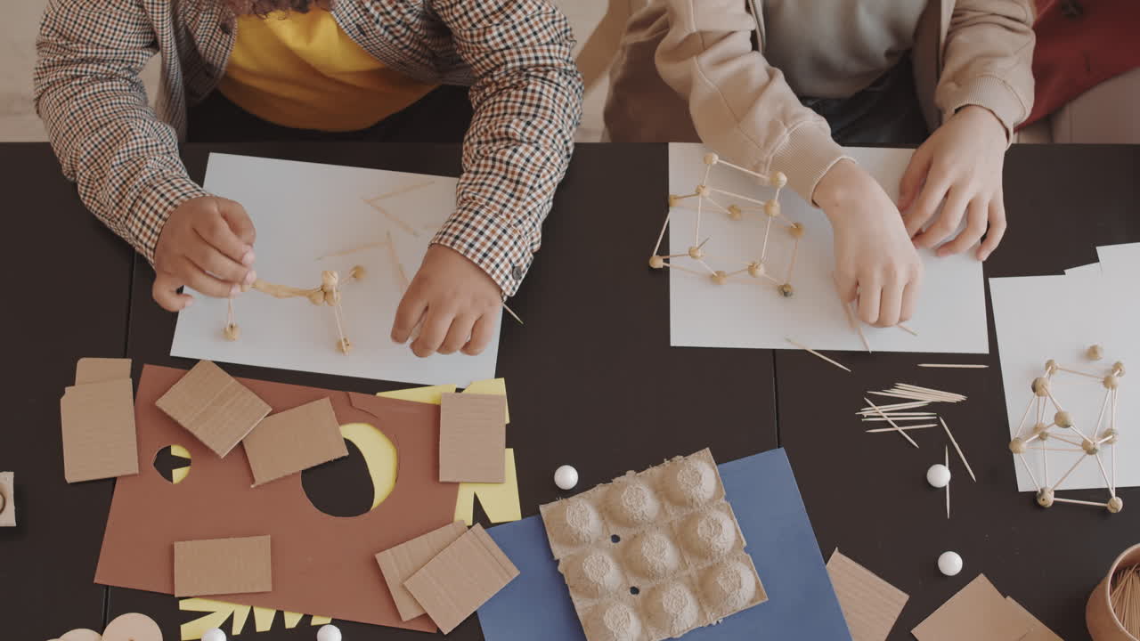 Students Making Crafts at Table