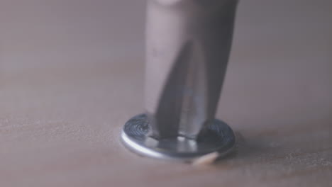 Extreme-close-up-of-screw-in-wood.-Static