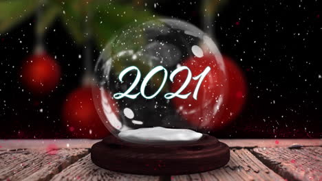 2021 en un globo de nieve