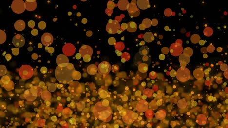 manchas brillantes amarillas y naranjas que se mueven contra un fondo negro