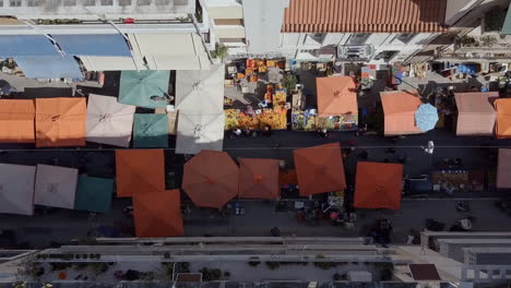 Drone-shot-looking-down-at-vibrant-street-market-Athens-Greece