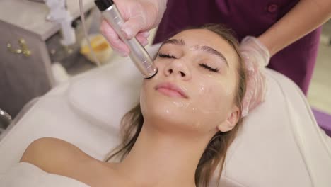 woman undergoing facial treatment at a spa