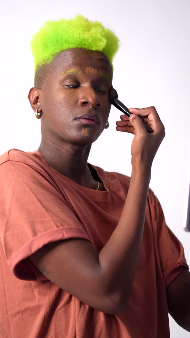 Man applying makeup