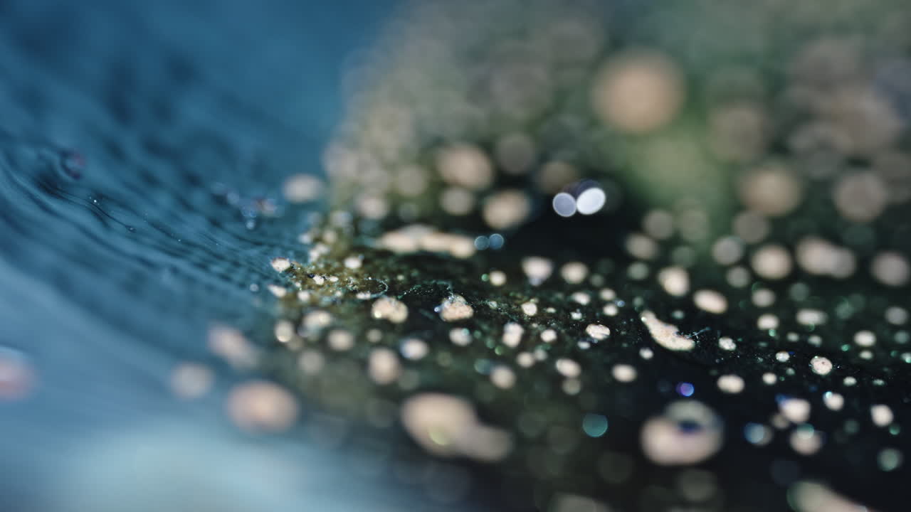 Effervescent tablet dissolving in dark liquid with fizzing bubbles and foaming, macro shot