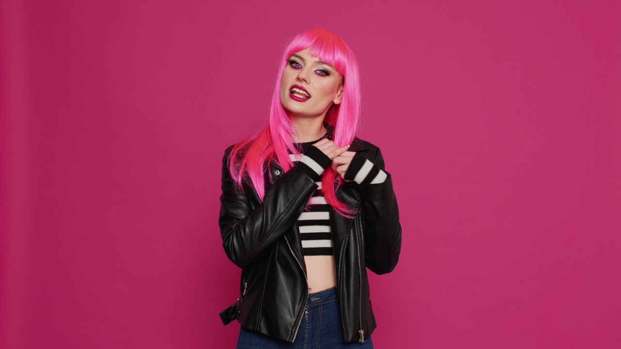 Young beautiful woman with leather jacket waving on videocall