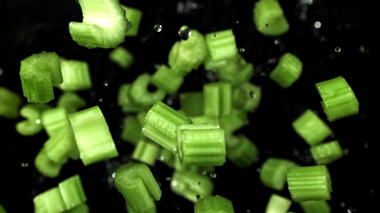 Super Slow Motion of Fresh Chopped Celery Falling with Water Droplets