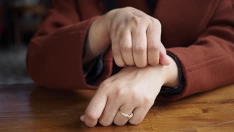 woman scratching her wrist