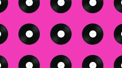 patrón geométrico con discos de vinilo vintage en un fondo rosado. gráficos de movimiento simple concepto de animación de música