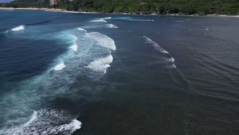 Coastal-scenery-with-distant-beaches-and-rolling-waves-in-the-foreground,-aerial