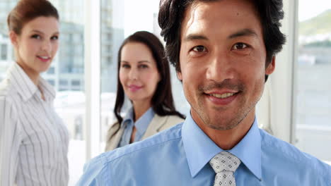 attractive business team smiling at camera