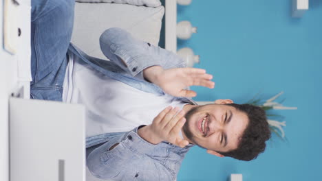 Vertical-video-of-Man-giving-greeting-and-applause-to-camera.