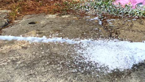 foam coming out of the end of the fire extinguisher hose