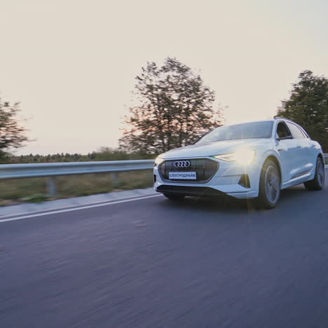 presentation of a white audi e-tron, compact luxury crossover suv. modern new cars for sale