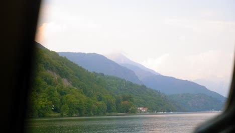 boat drives through italian mountain side