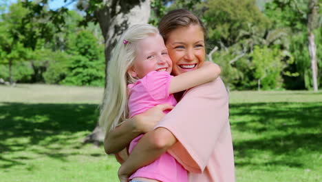 Woman-hugging-her-daughter-tightly