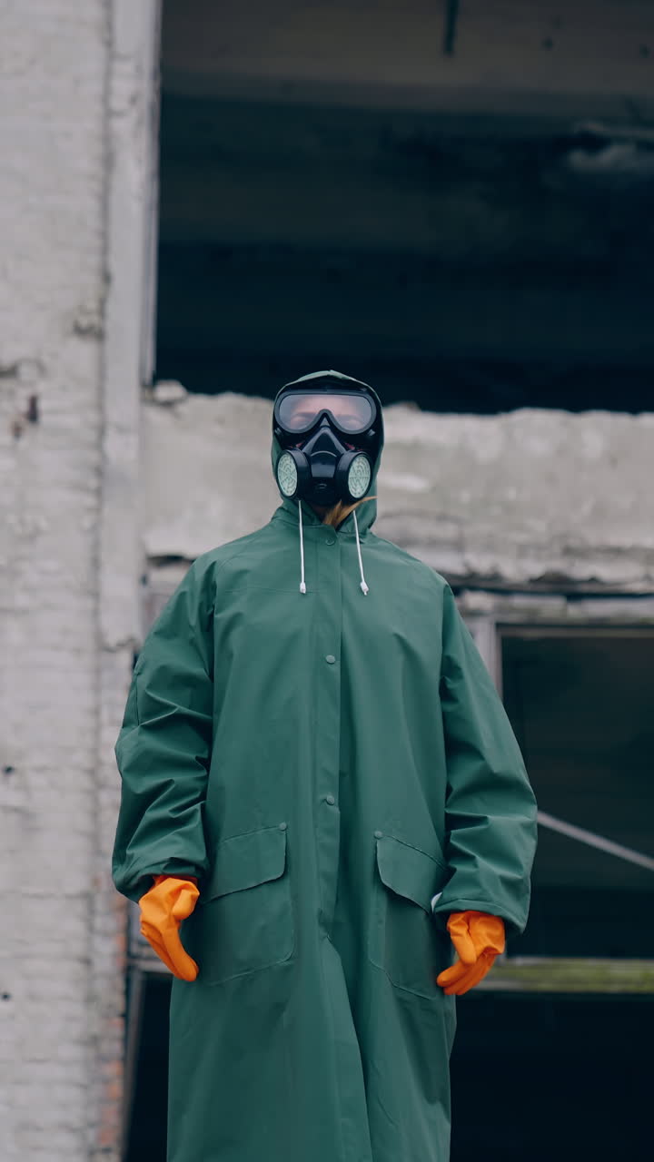 Environmental pollution, ecological disaster, nuclear war, post apocalypse concept. Care for future generations. Human in protective mask, face-guard to prevent breathing toxic air. Vertical video