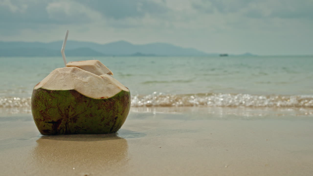 Coconut drink on the beach