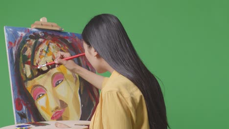 woman painting a portrait