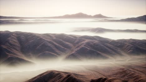 mountain landscape with deep fog at morning