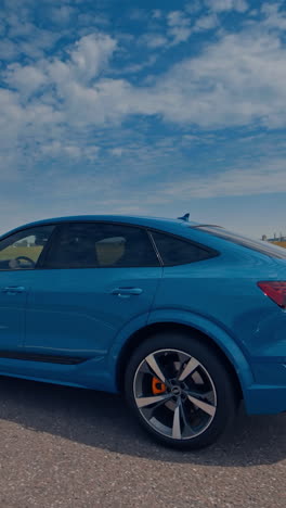 stylish auto speed driving and traveling. new modern city car driving on the road. vertical video
