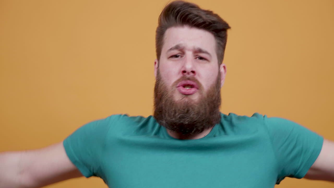 Man with beard looking at camera