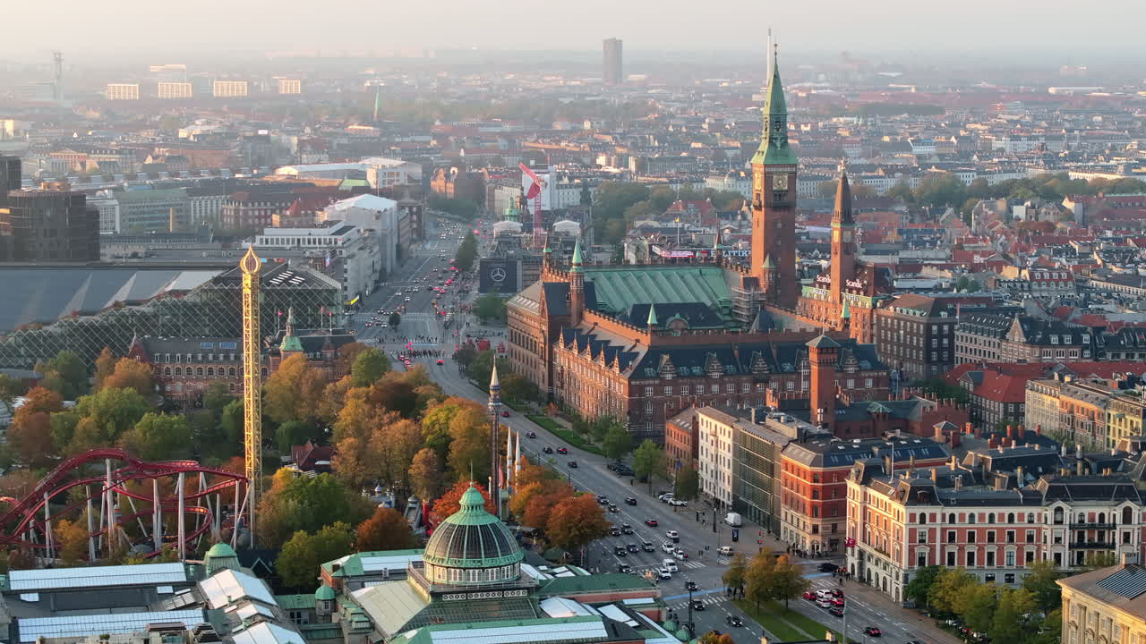 Aerial drone view of the Tivoli amusement park and the City Hall in Copenhagen, Denmark at sunset