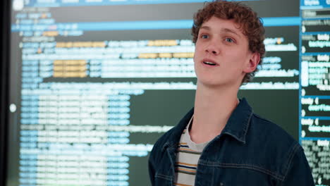 a programer with computer code in the background