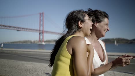 happy multiethnic women walking outdoor