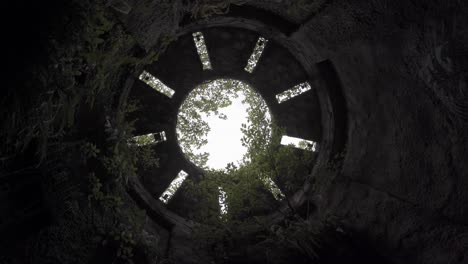 the camera spins around the inside of an ancient castle ruin