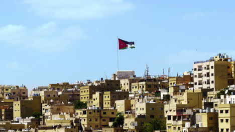 jordanian flag over cityscape