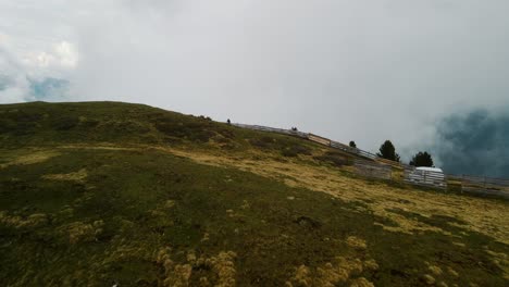 Drone-Goes-Over-SEISER-ALM-Cliff-Revealing-The-Fog-And-Deep-Falling-Distance---Establishing-Shot