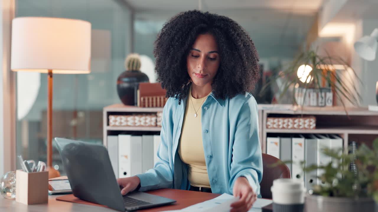 Woman working at her desk in a modern office