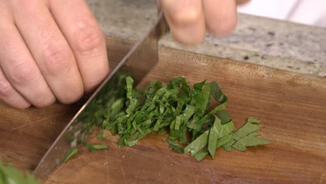 professional chef chopping parsley leaves