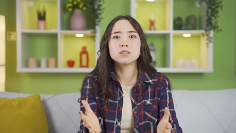 Nervous-Asian-young-woman-is-tensing-and-shouting.