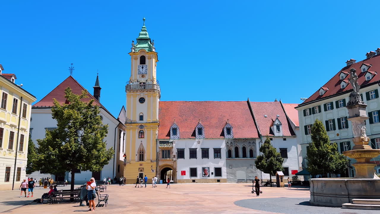 Bratislava, Slovakia, 2 June 2025: Beautiful square with a fountain in the middle. Architecture of old town in Bratislava, Slovakia in summer