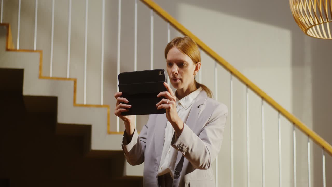 Businesswoman using tablet at home